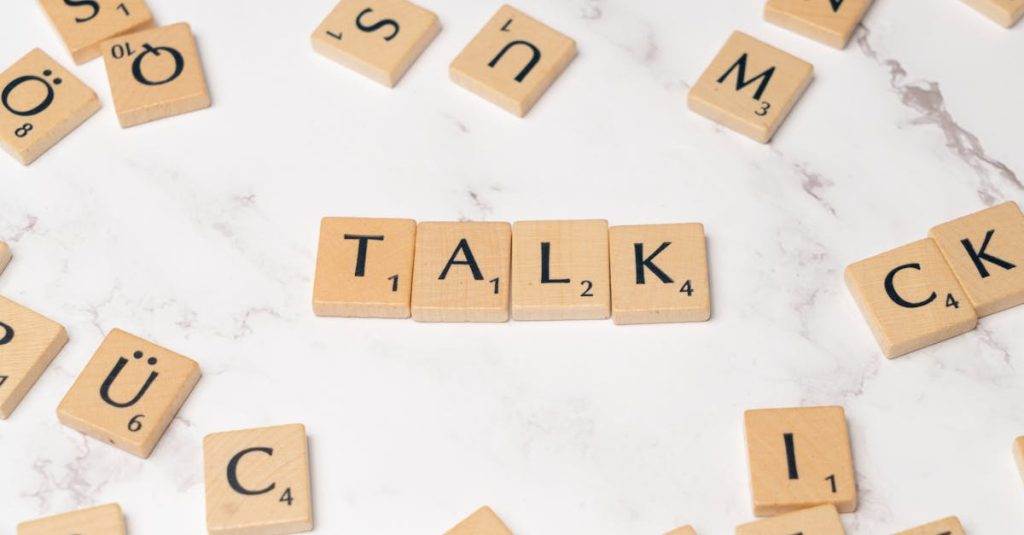 The word talk is spelled out in scrabble letters